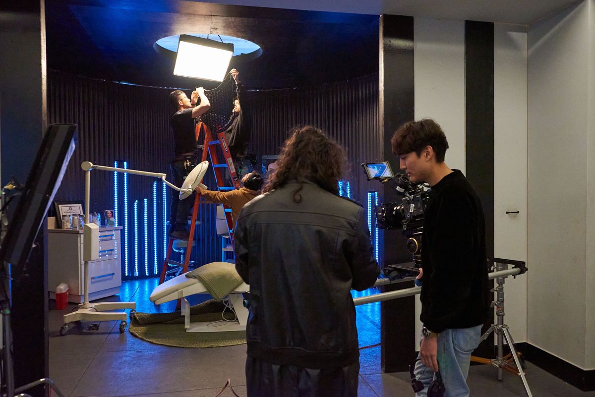 Rigging the stage under blue light