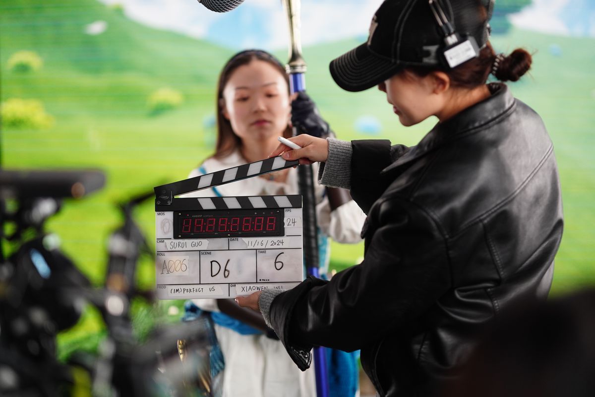 Slate in on a green screen exterior